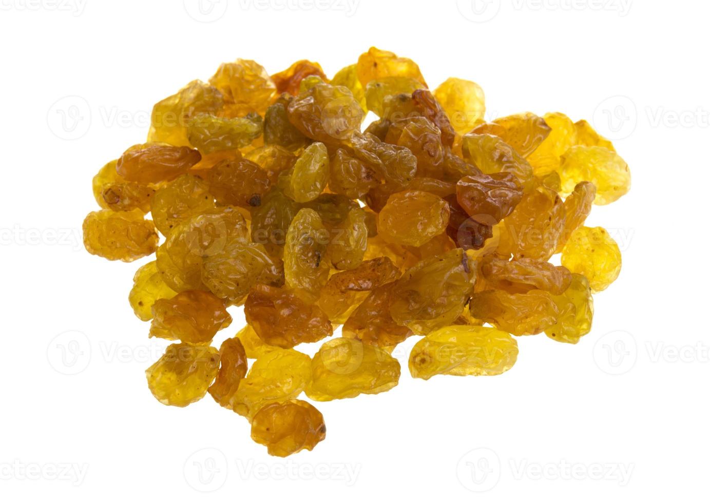 Golden raisins over white photo