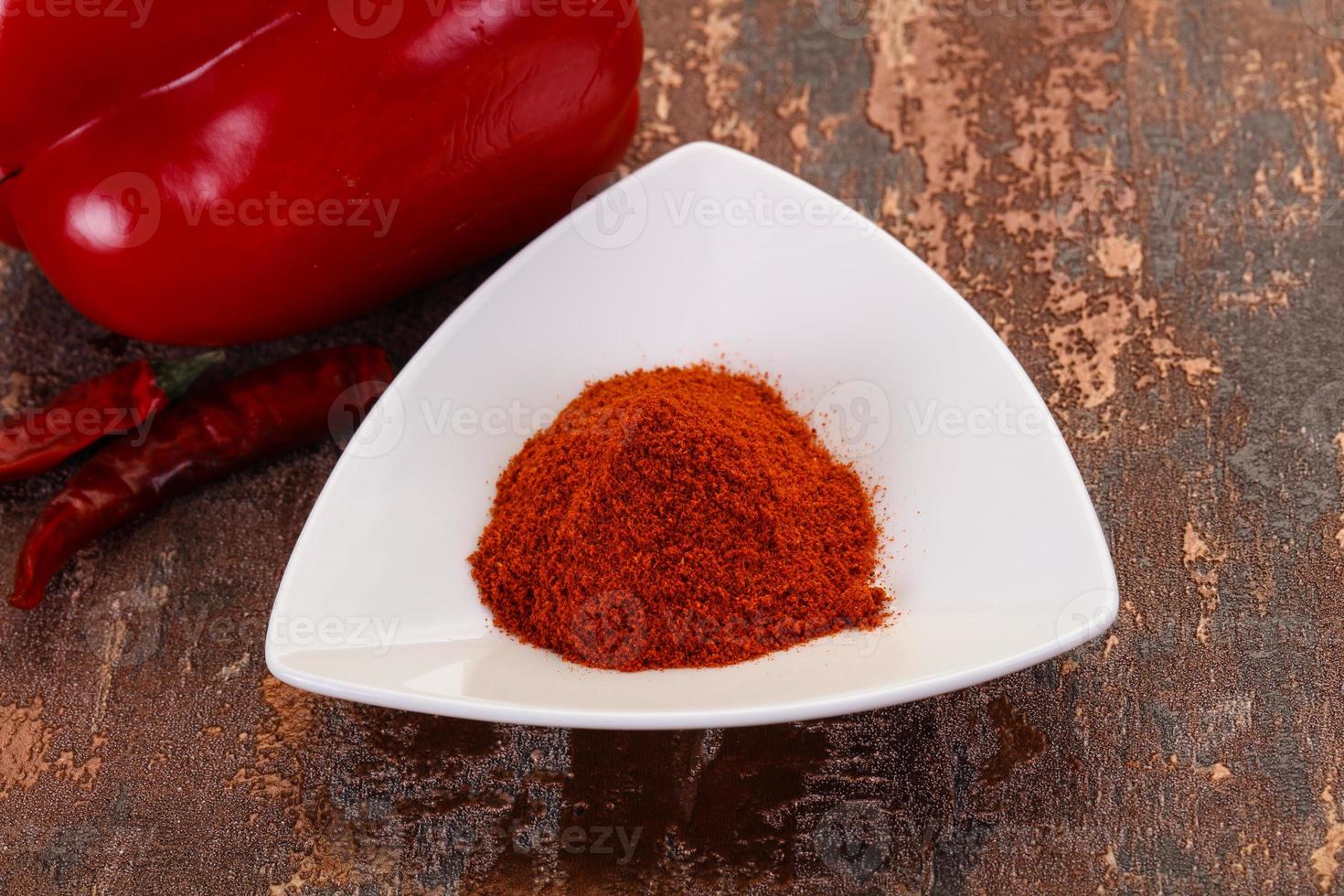 Paprika powder in the bowl photo