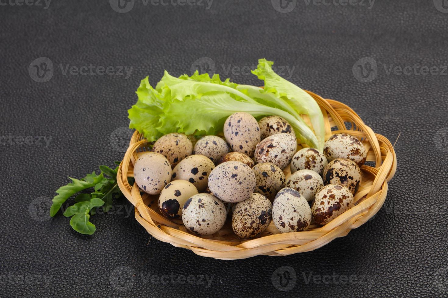 Quail eggs in the basket photo