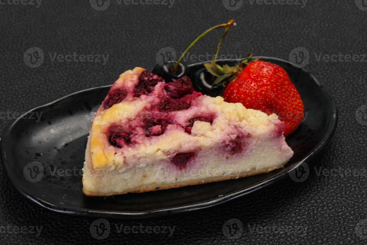 Cheesecake with cherry served strawberry photo