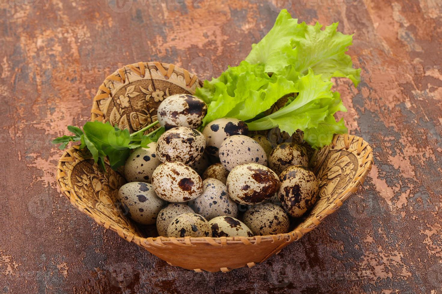 Quail eggs in the basket photo