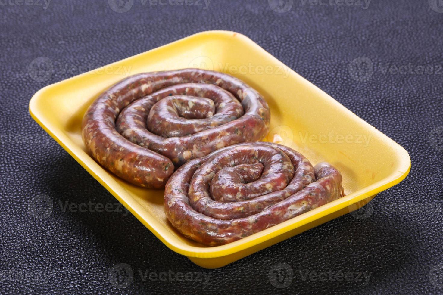 Raw beef sausages photo