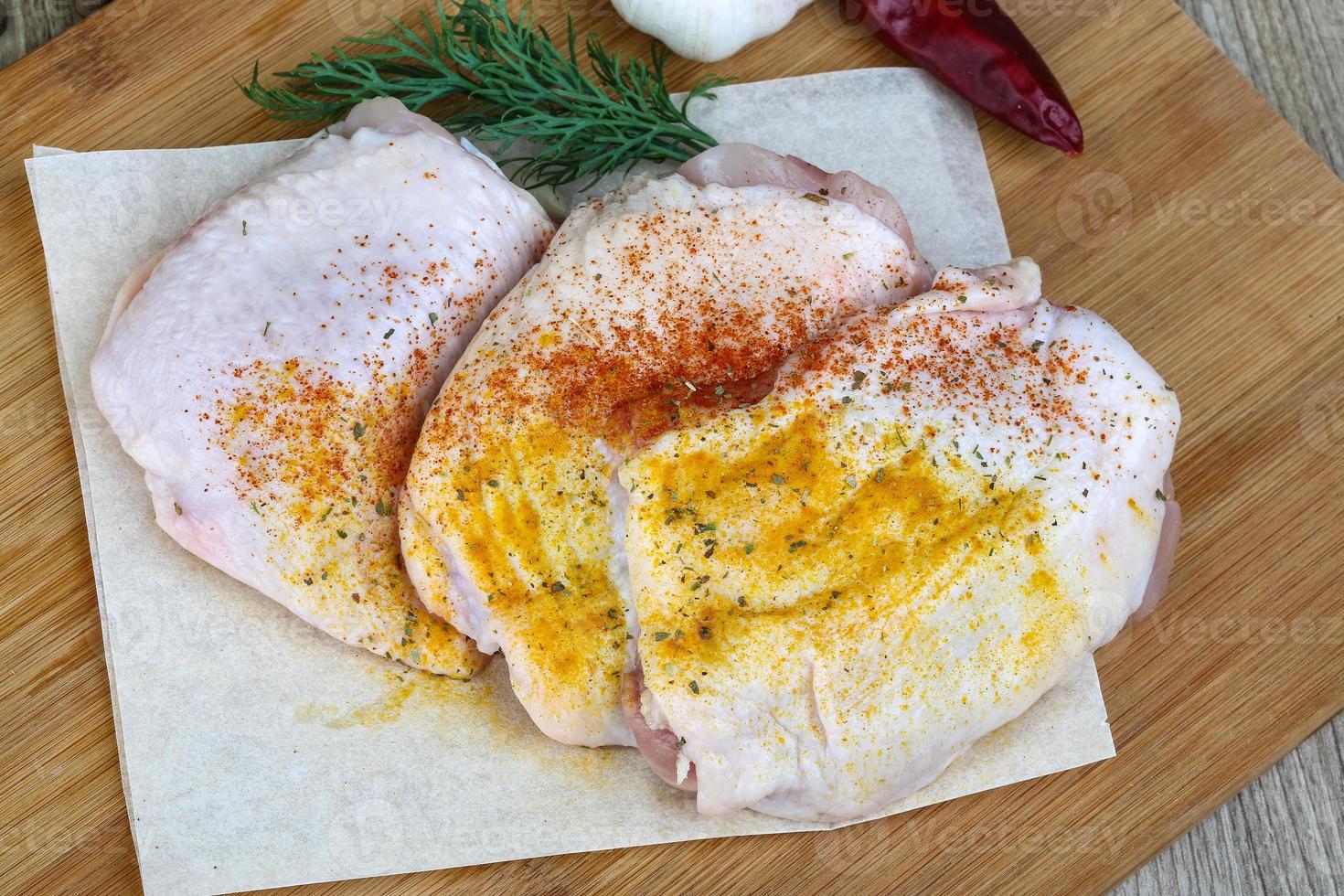 Raw chicken thights photo