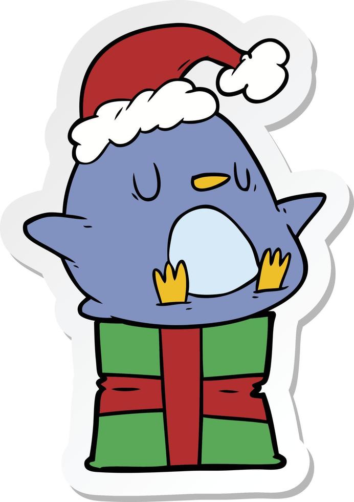 sticker of a cute cartoon penguin sitting on gift vector