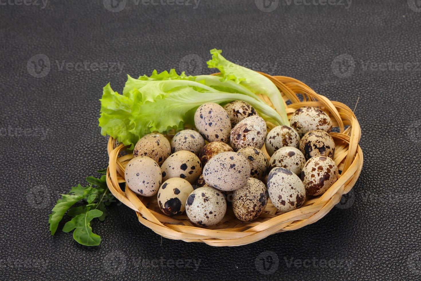 Quail eggs in the basket photo