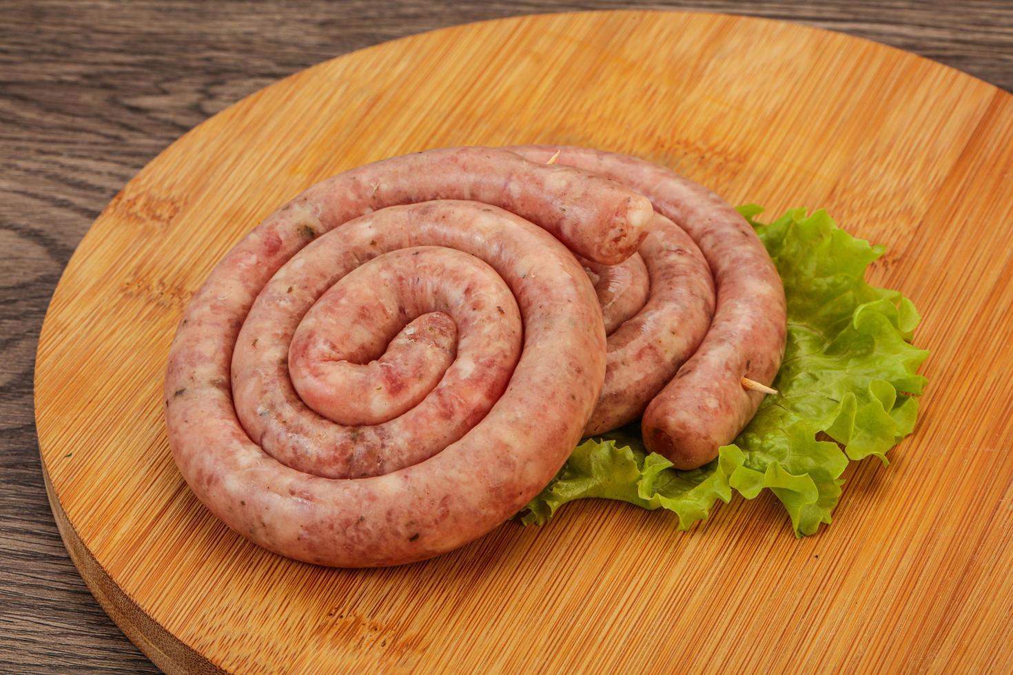 Raw sausage ring for grill photo