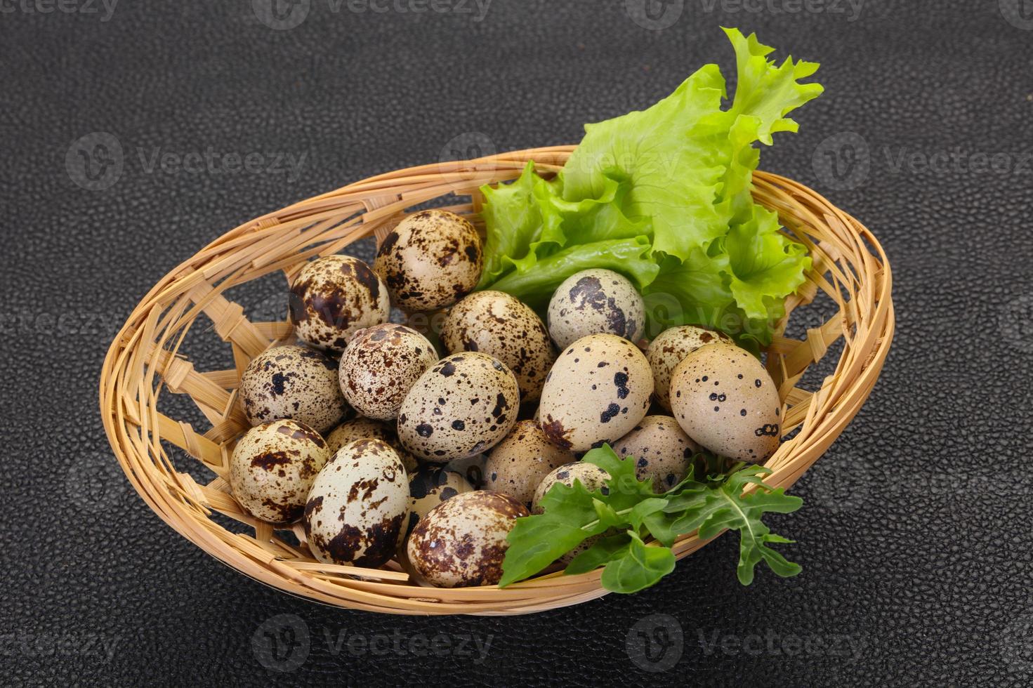 Quail eggs in the basket photo