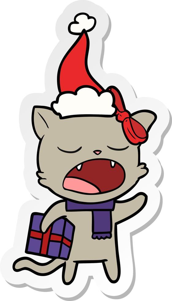 sticker cartoon of a cat with christmas present wearing santa hat vector