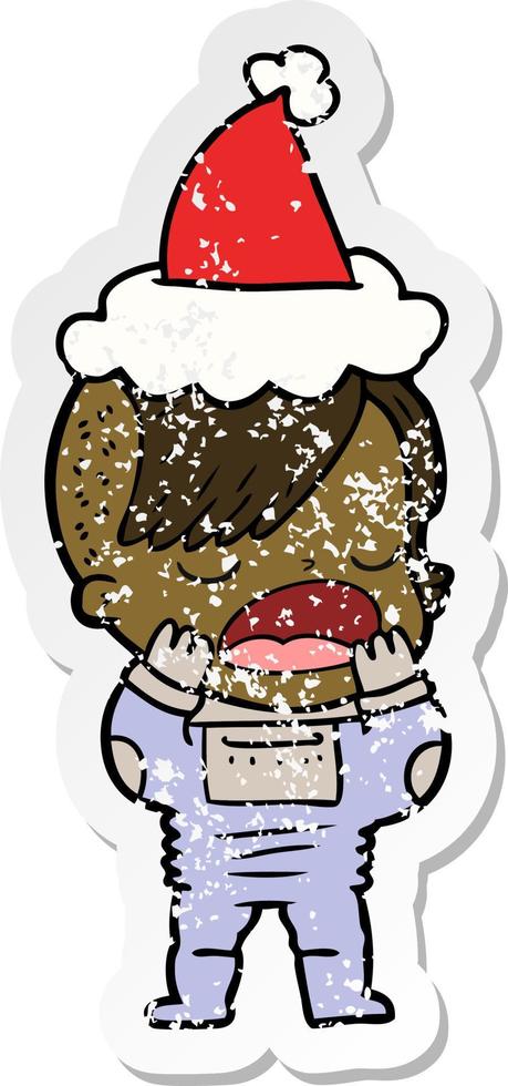 distressed sticker cartoon of a cool hipster girl in space suit wearing santa hat vector
