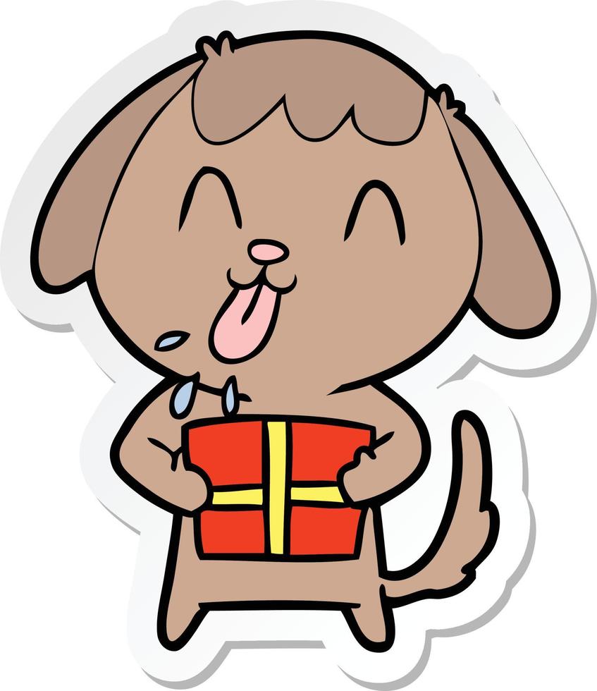sticker of a cute cartoon dog with christmas present vector