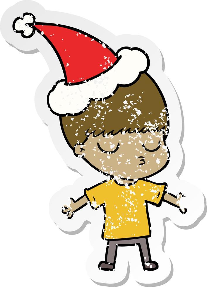 distressed sticker cartoon of a calm boy wearing santa hat vector