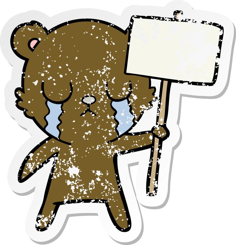 distressed sticker of a crying cartoon bear with sign vector