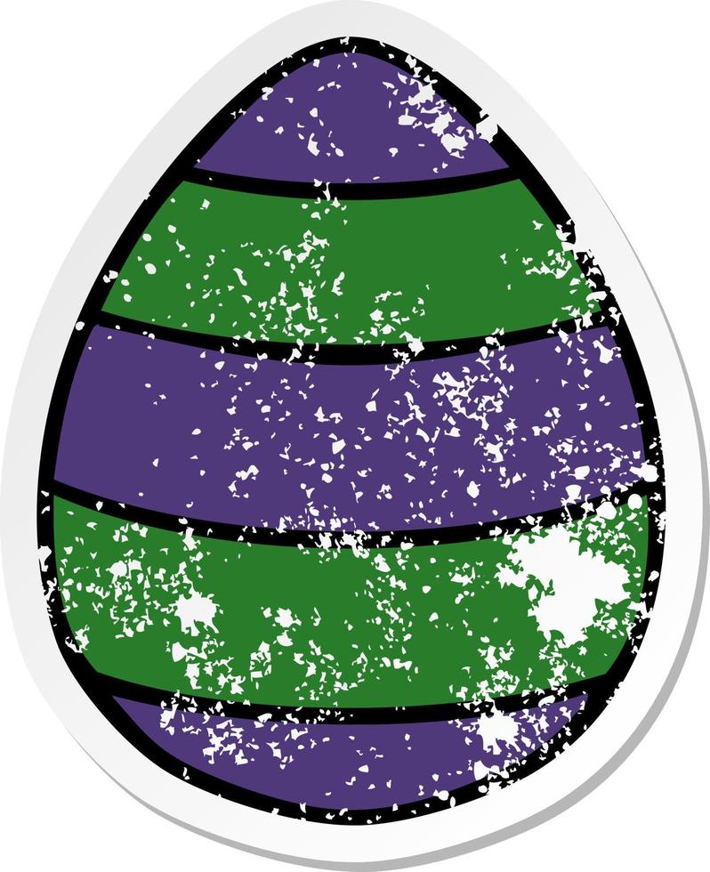 distressed sticker of a quirky hand drawn cartoon easter egg vector