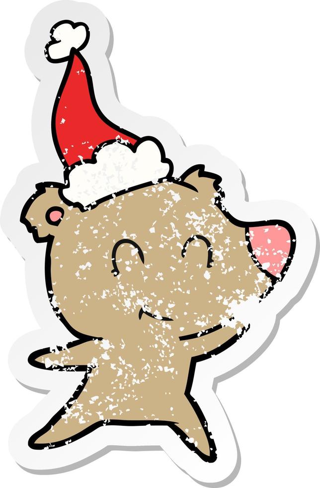female bear distressed sticker cartoon of a wearing santa hat vector