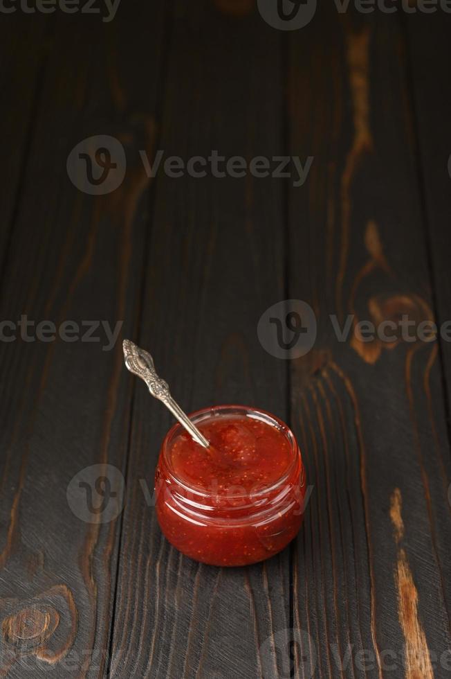 homemade strawberry jam in jar photo