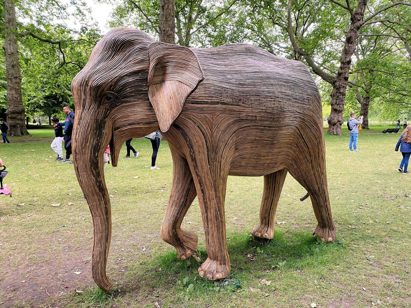 London in the UK in July 2021. A view of some Wooden Elephants in a park in London photo