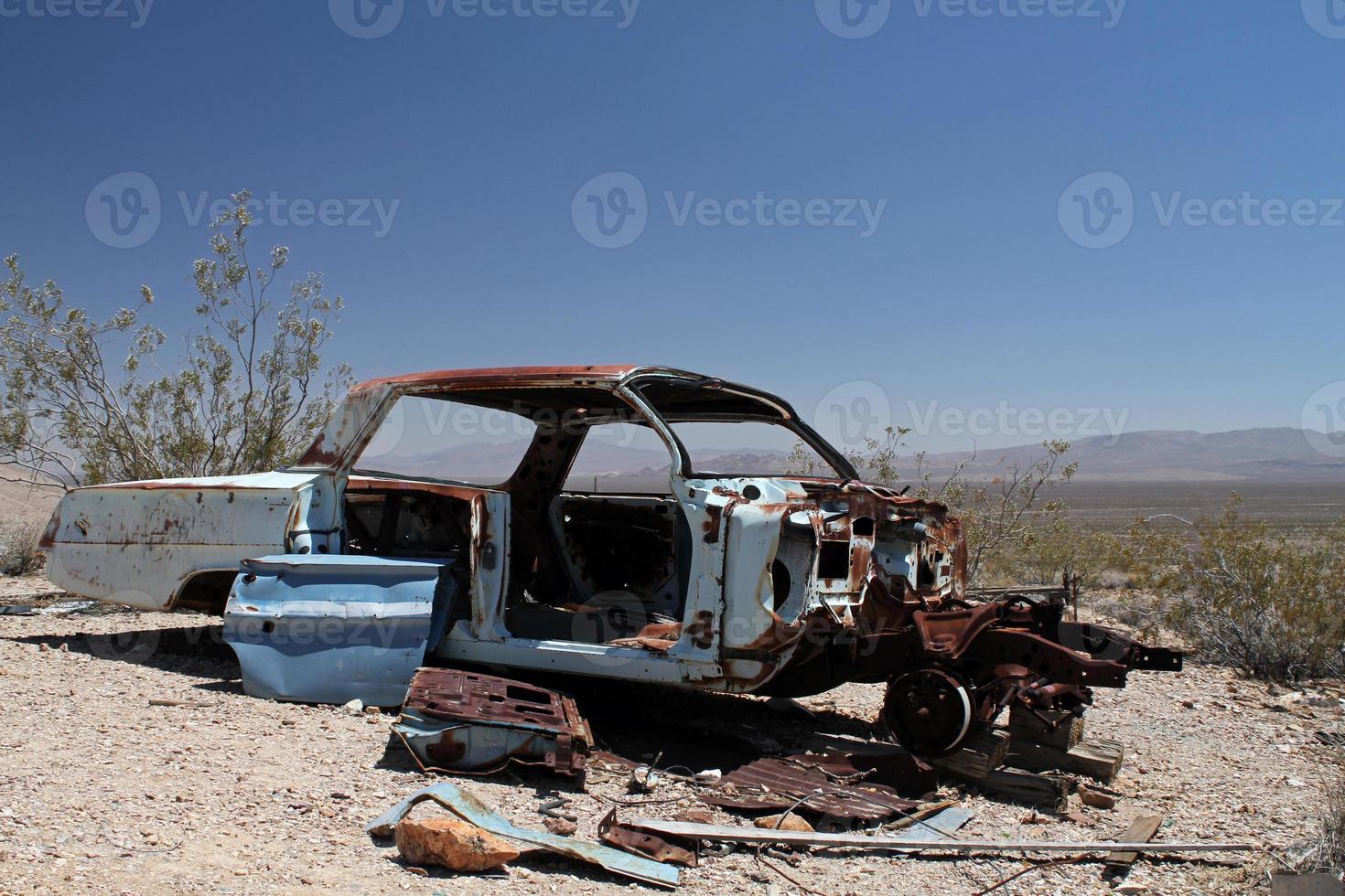 Wrecked and rusty car in Death Valley photo