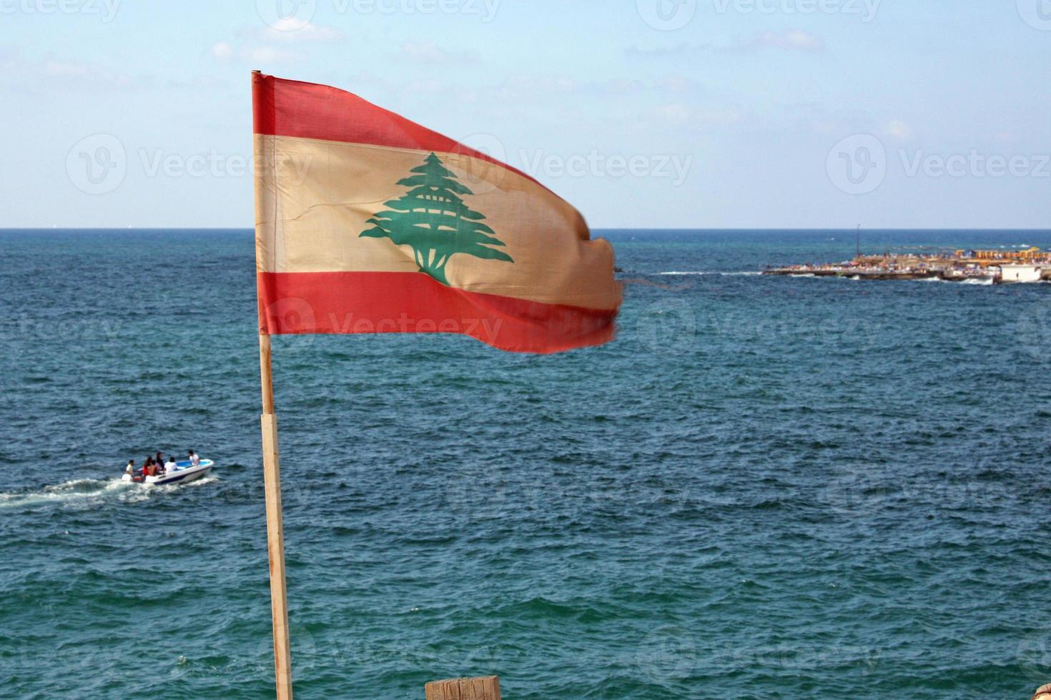 Lebanese flag waving at the coast of Beirut, Lebanon photo