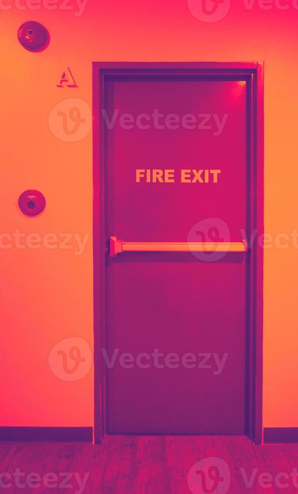 Fire exit door. Fire exit emergency door red color metal material photo