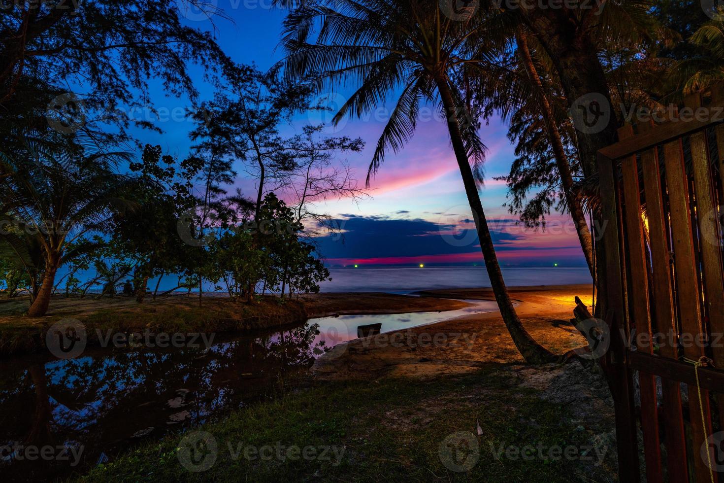 Purple violet sky at the beach and sea, in Twilight Time, Koh Kood, Trad province, Thailand. photo