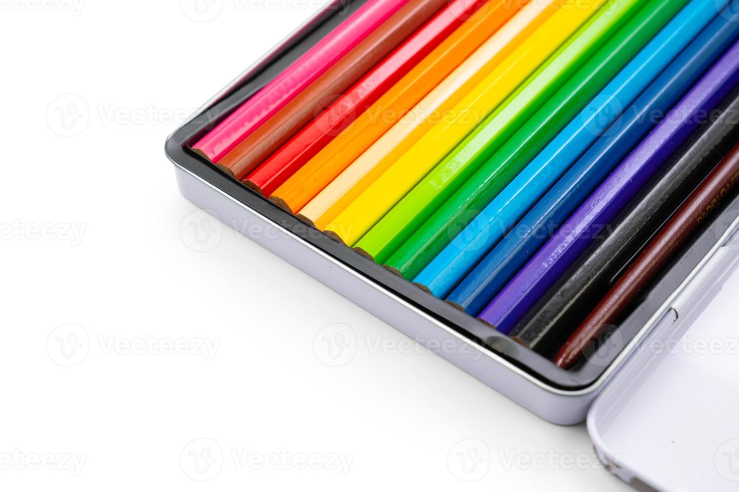 Used 12 colour pencils and apply to water colour painting. There are arranged in steel box on white background in stuido light. Clipping path. photo