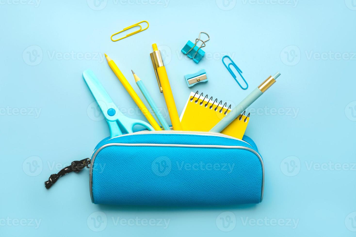 Top view of pencil case with school supplies. Back to school concept photo