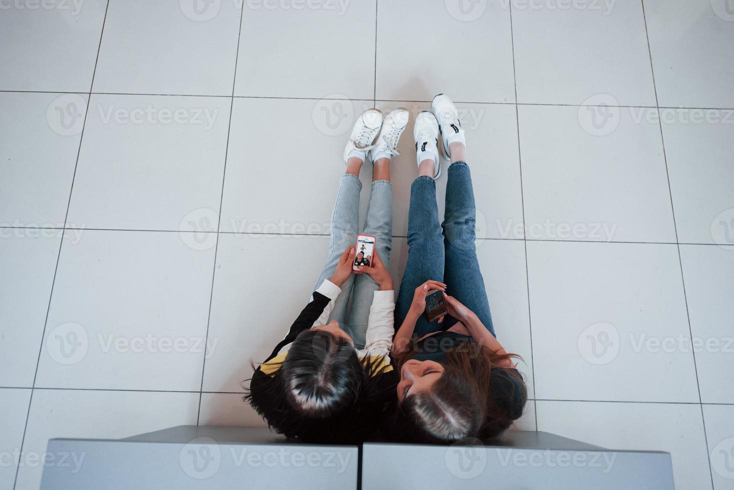 Top view of young people in casual clothes working in the modern office photo