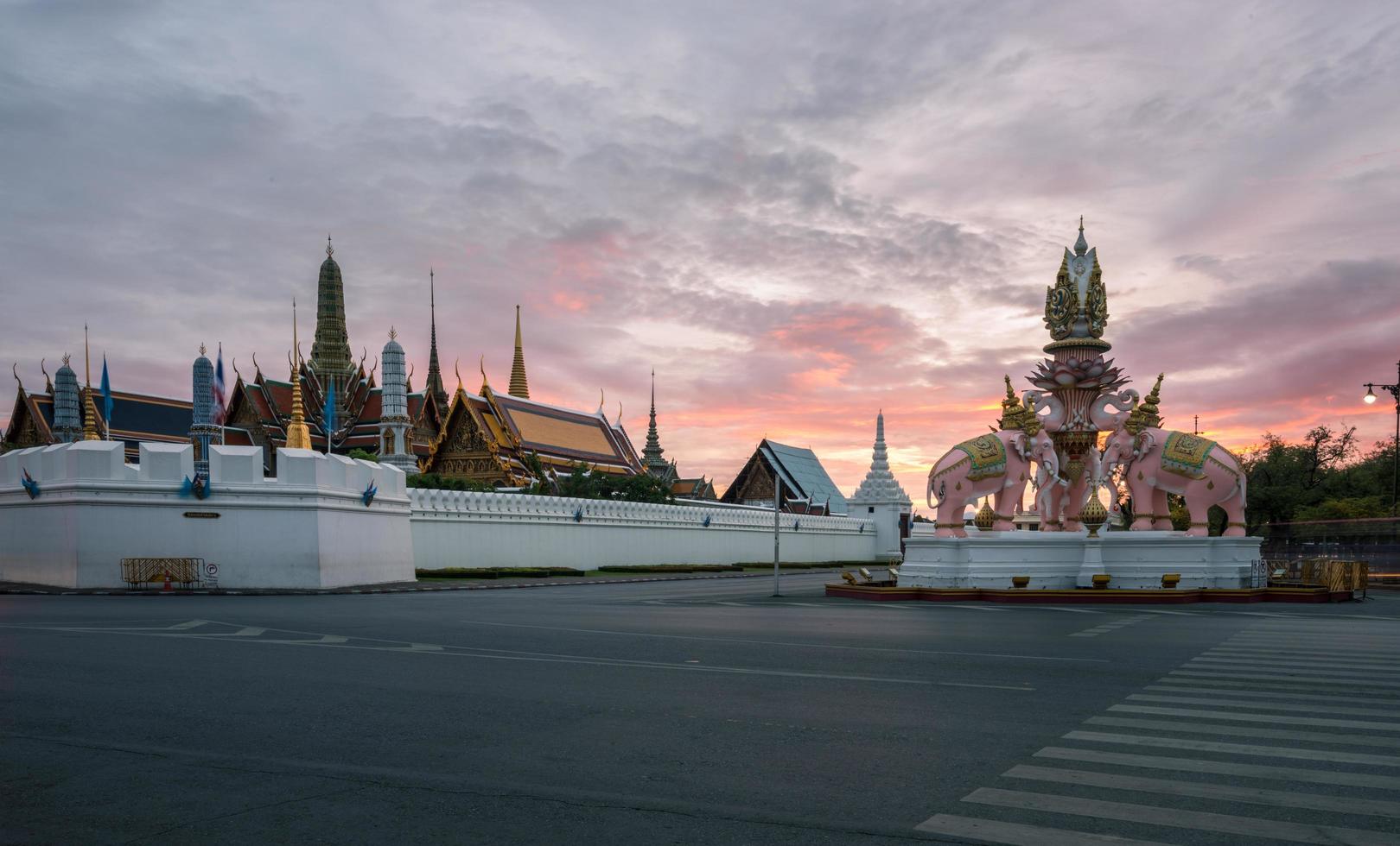 The emerald temple and the royal palace of Bangkok, the iconic landmark of Bangkok the capital city of Thailand at dusk. photo