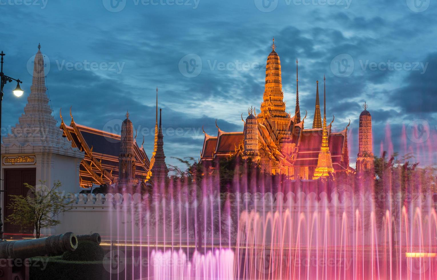 The emerald temple and the royal palace of Bangkok, the iconic landmark of Bangkok the capital city of Thailand at dusk. photo