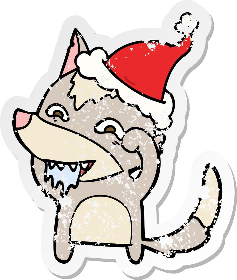 distressed sticker cartoon of a hungry wolf wearing santa hat vector