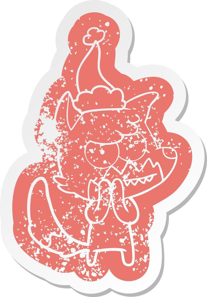 cartoon distressed sticker of a grinning fox wearing santa hat vector
