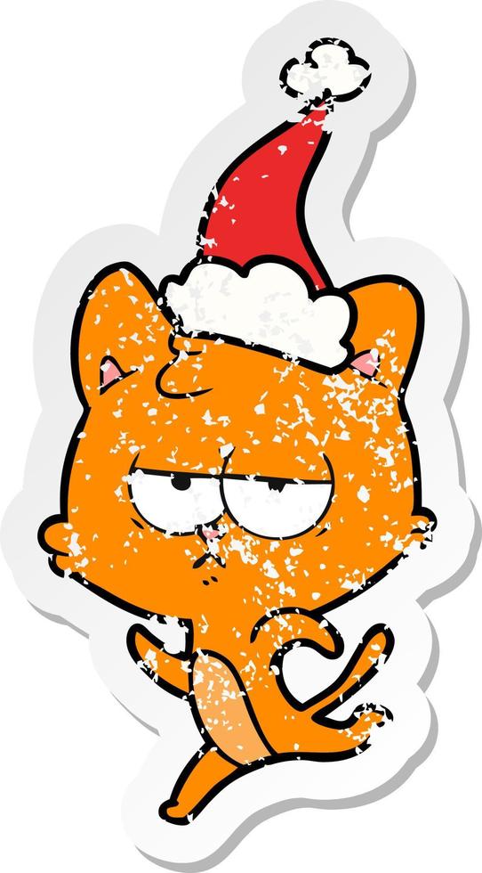 bored distressed sticker cartoon of a cat wearing santa hat vector