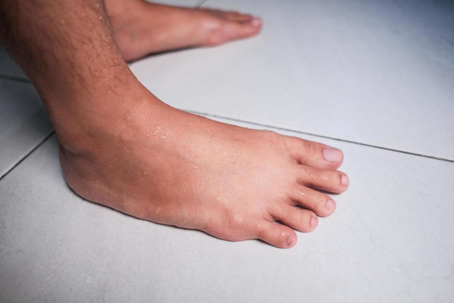 Woman foot on white background, isolated, close-up photo