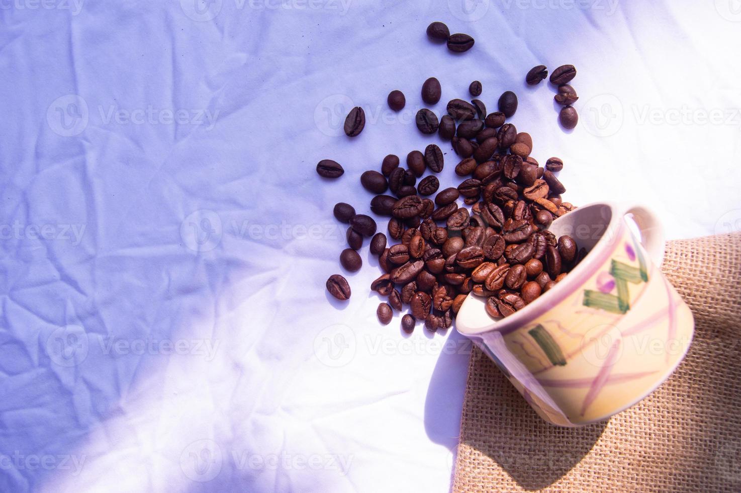 coffee bean background spilled in glass. isolated white background photo