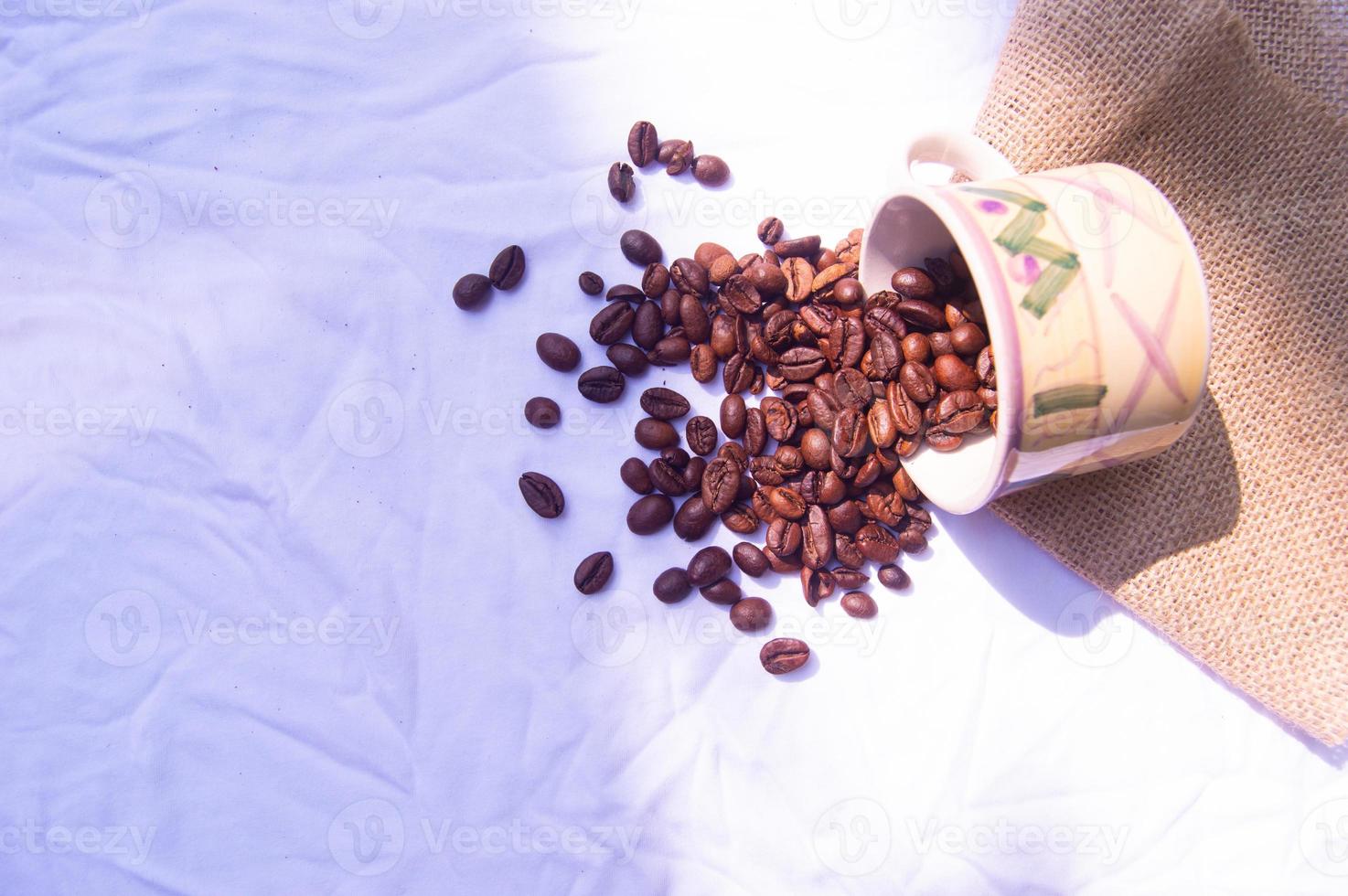 coffee bean background spilled in glass. isolated white background photo