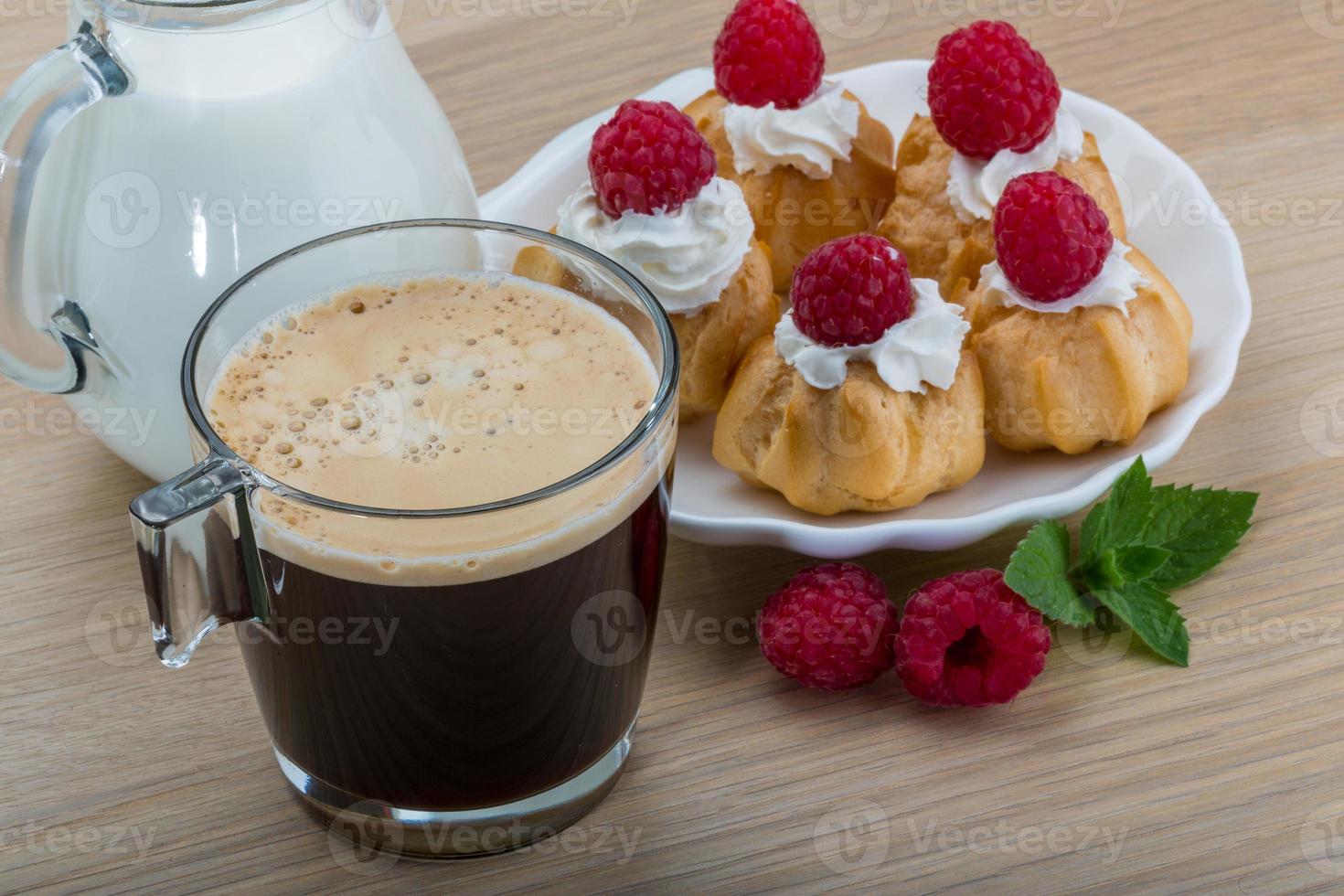 Profiterole with raspberry photo