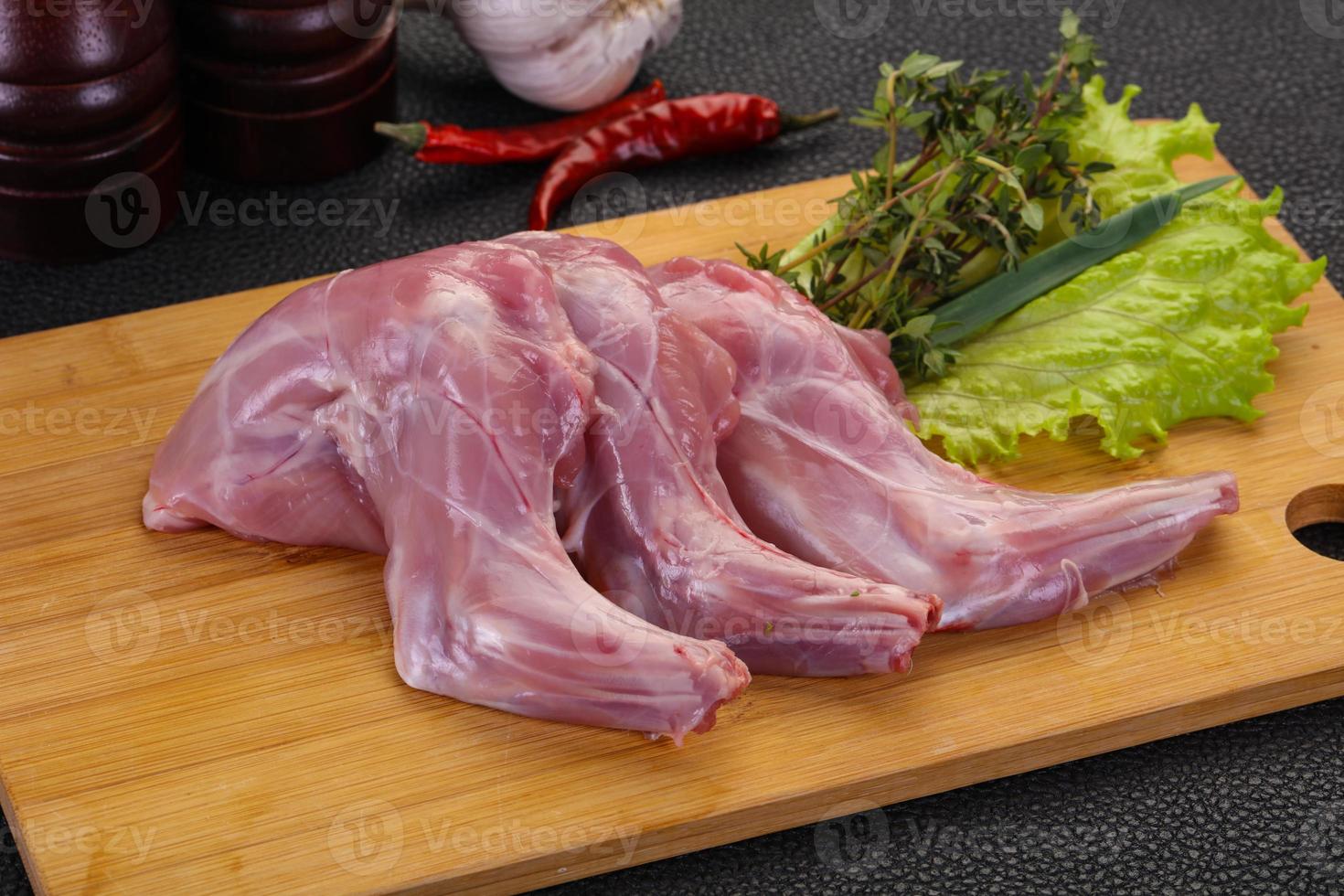 Raw rabbit legs photo