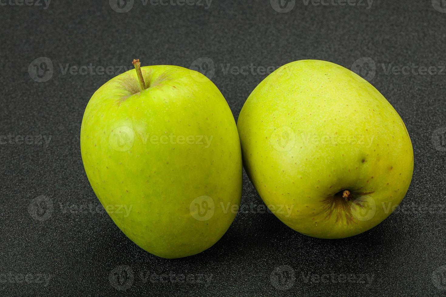 Two ripe green sweet apples photo