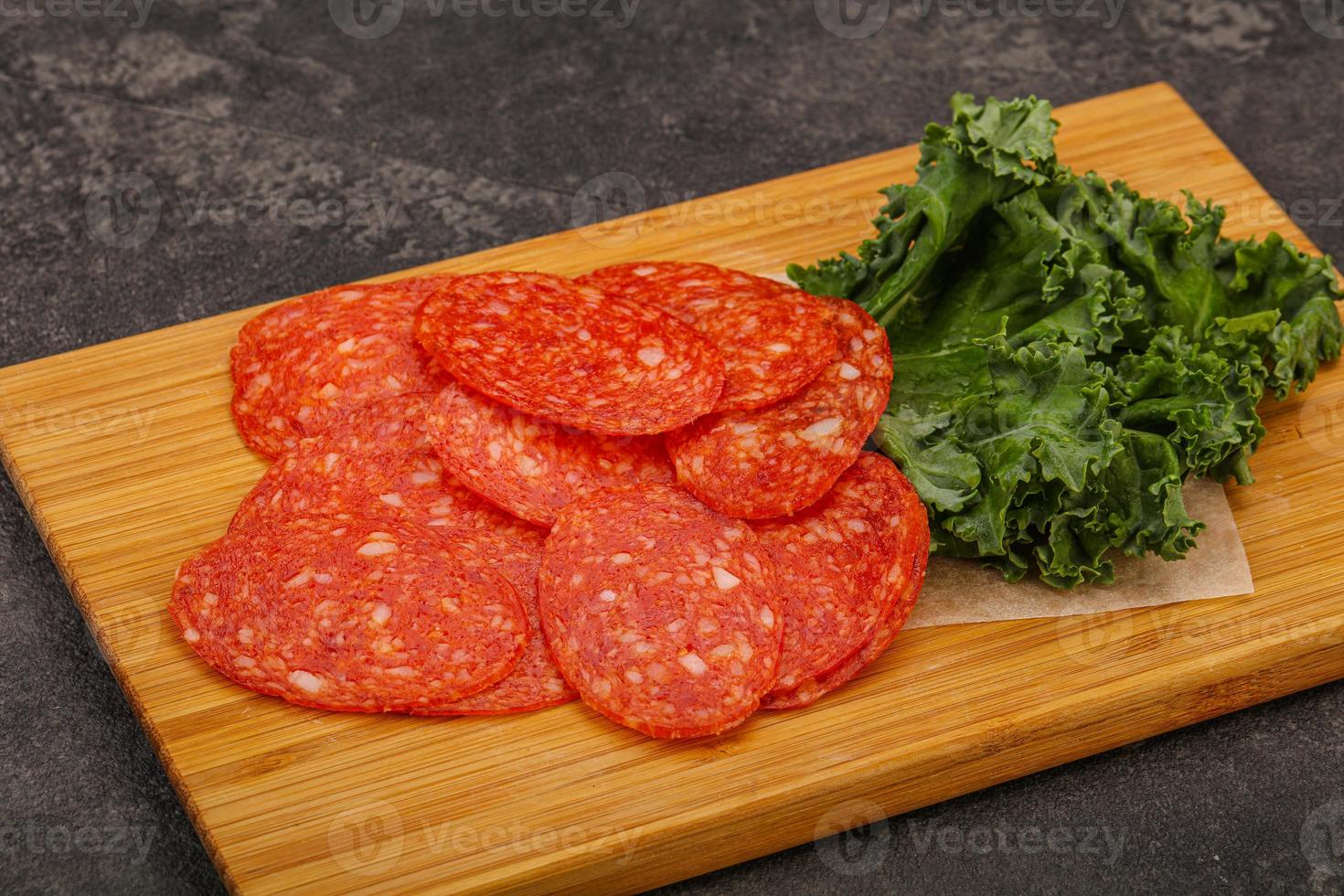 Italian spycy pepperoni sausage slices photo