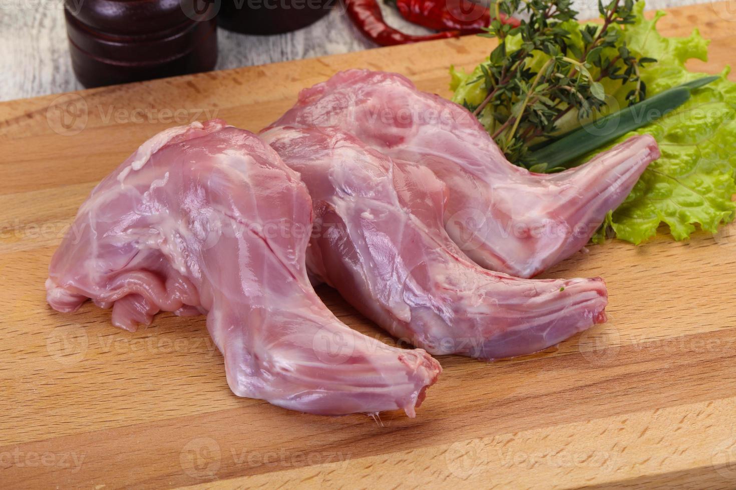Raw rabbit legs photo