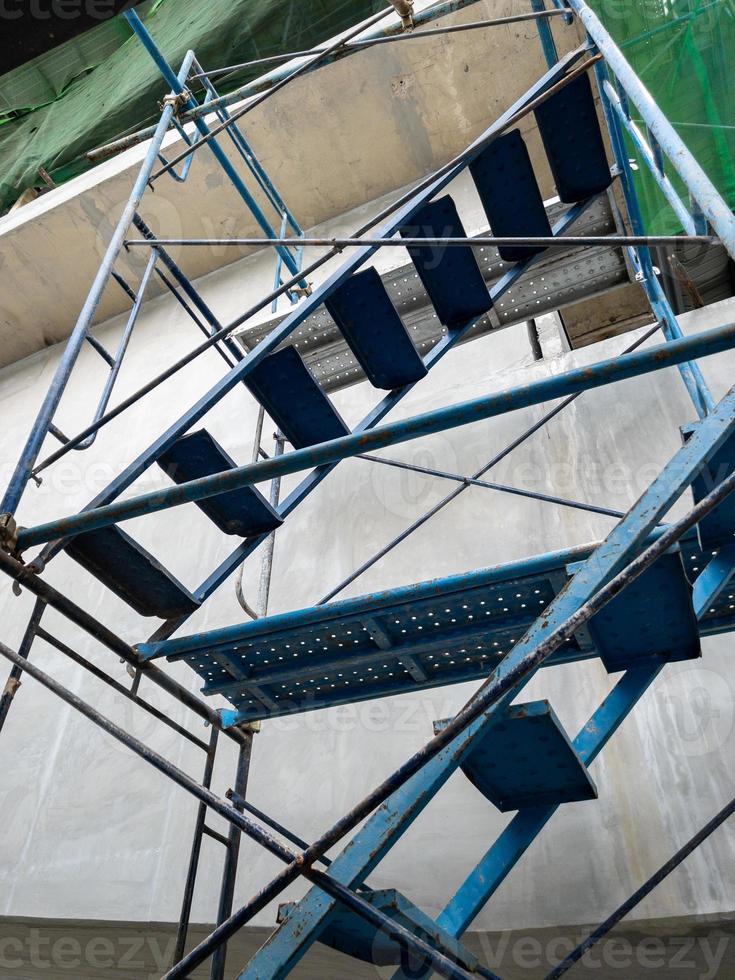 View from below of the scaffolding near the monorail station is under construction. photo