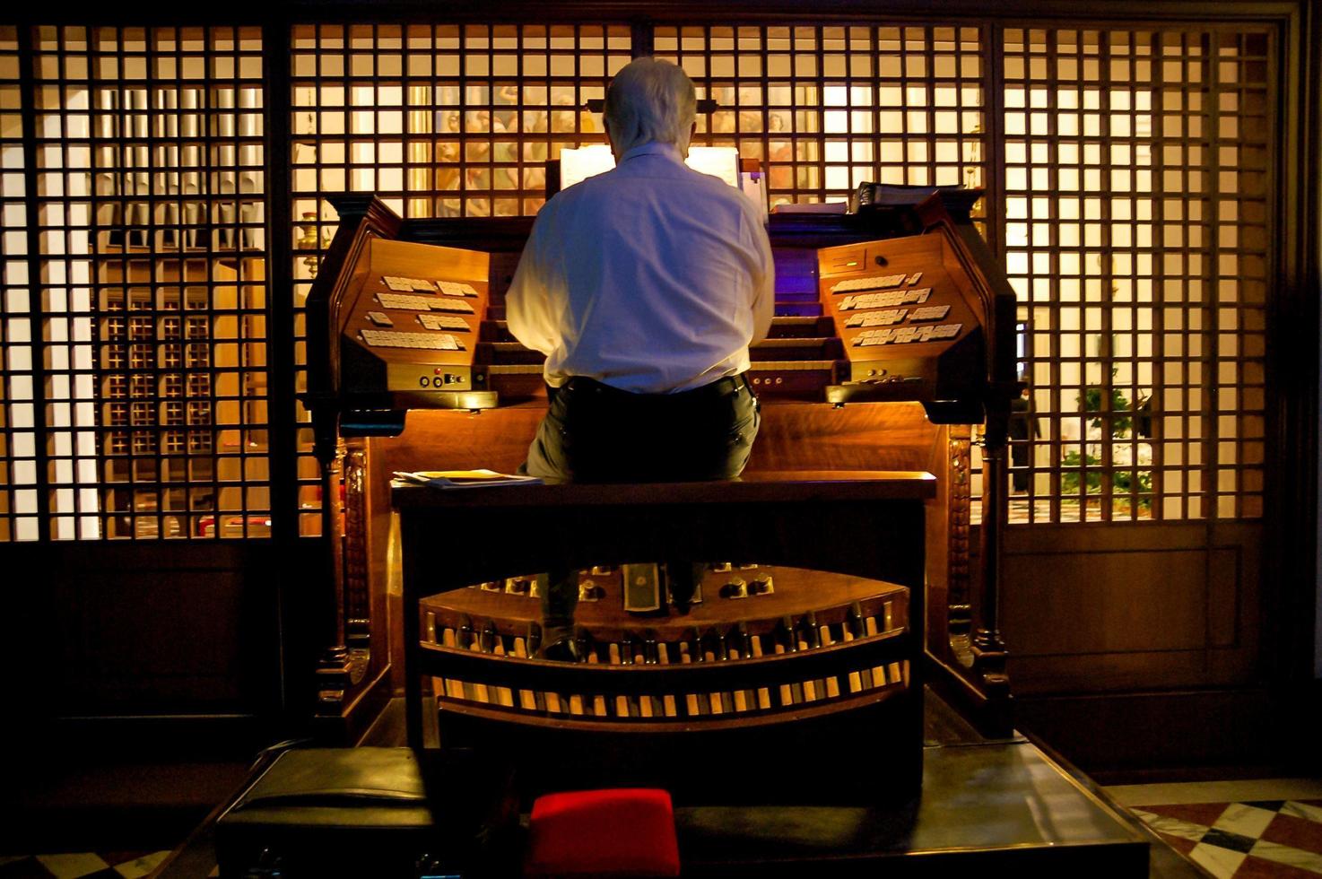 Tokyo, Japan, 2021 - Organist Playing a Organ photo