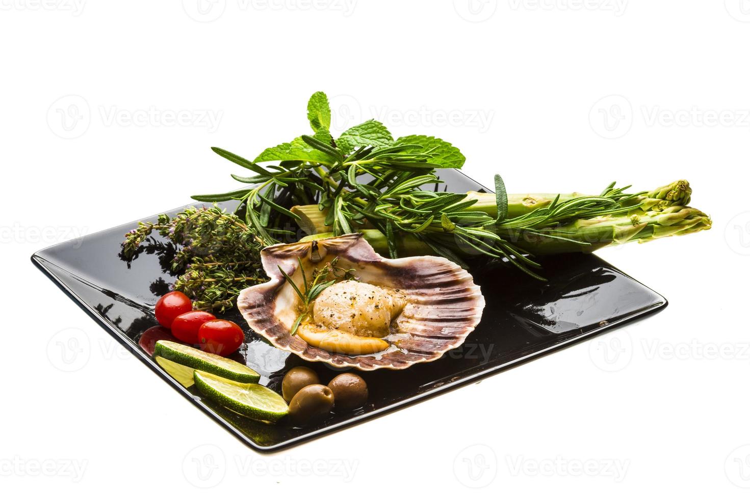 Scallop with asparagus, lime, mint and rosemary photo