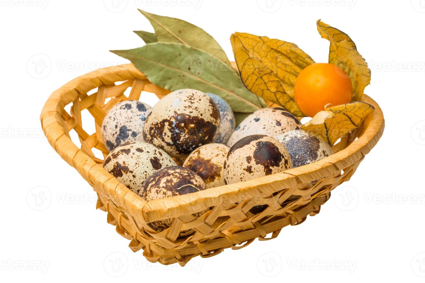 Quail eggs on white photo