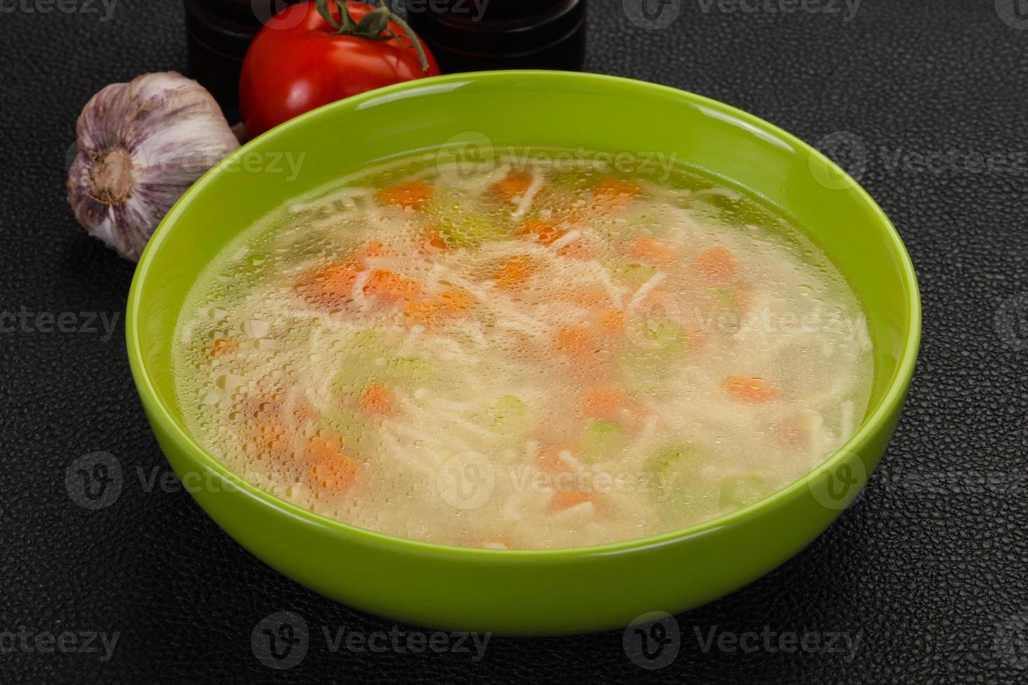 Chicken soup with noodles photo