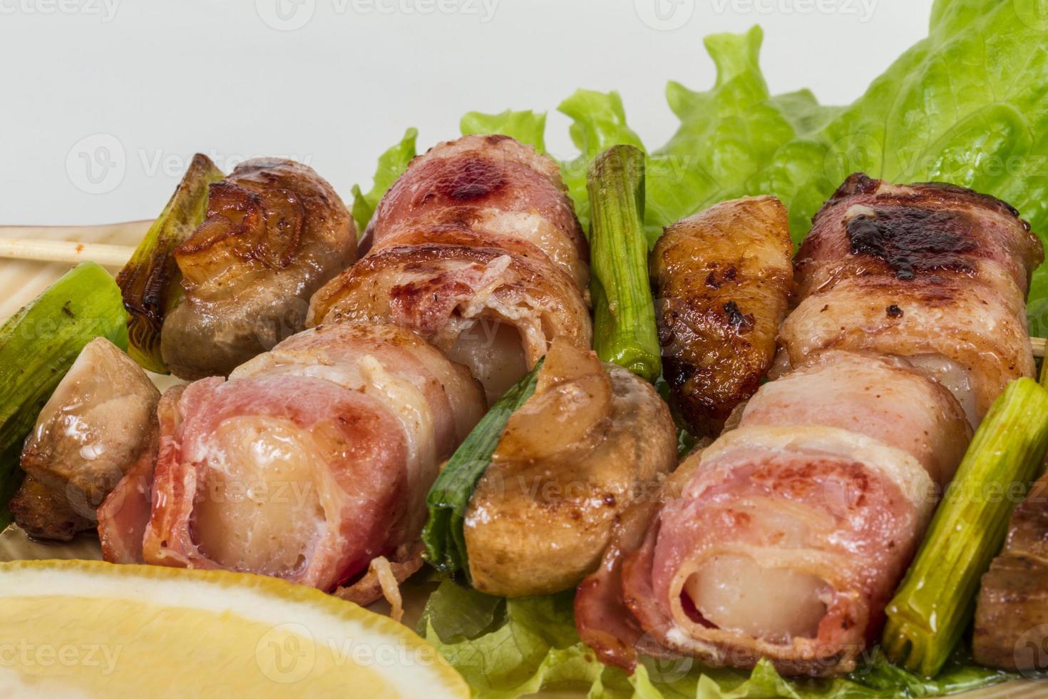 Bacon wrapped grilled Scallops with mushrooms and bacon photo