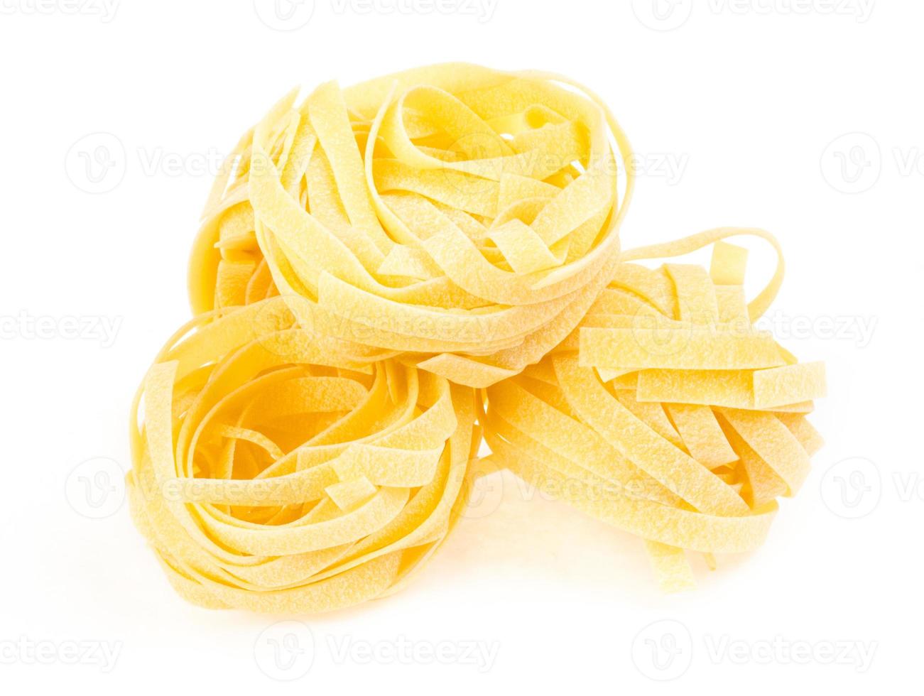 Italian pasta fettuccine nest isolated on white background photo