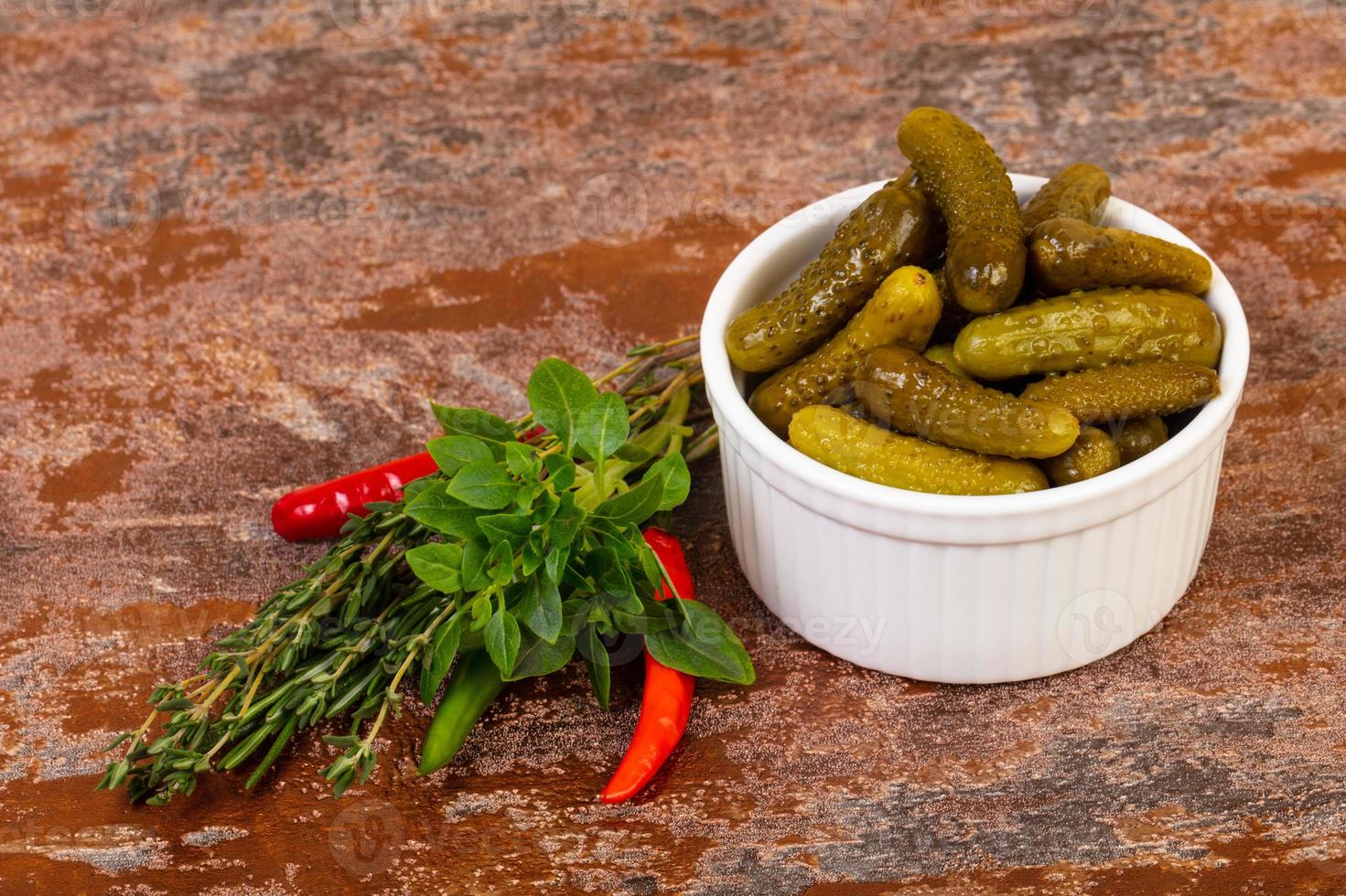 Pickled small cucumbers photo