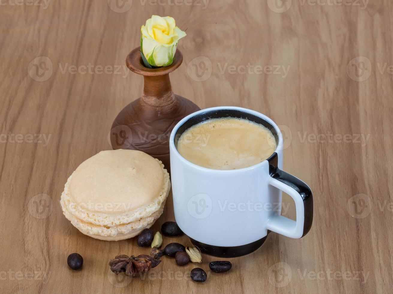 Coffee with macaroons and rose photo
