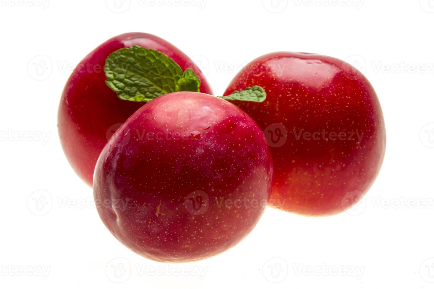 Bright ripe plum with mint photo